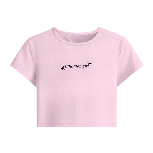 Pink t-shirt with 'cinnamon girl' text on a white background