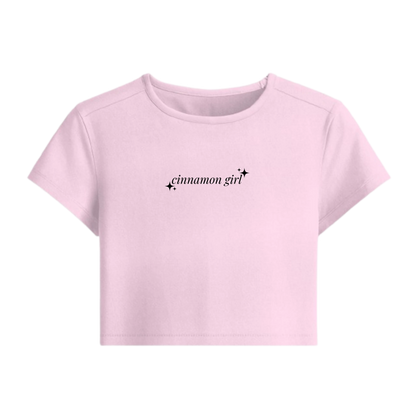 Pink t-shirt with 'cinnamon girl' text on a white background